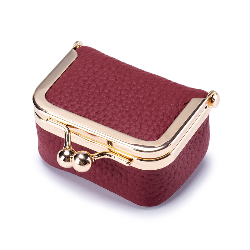 Women's mini travel jewelry box with multiple compartments, genuine leather for organized rings and earrings.