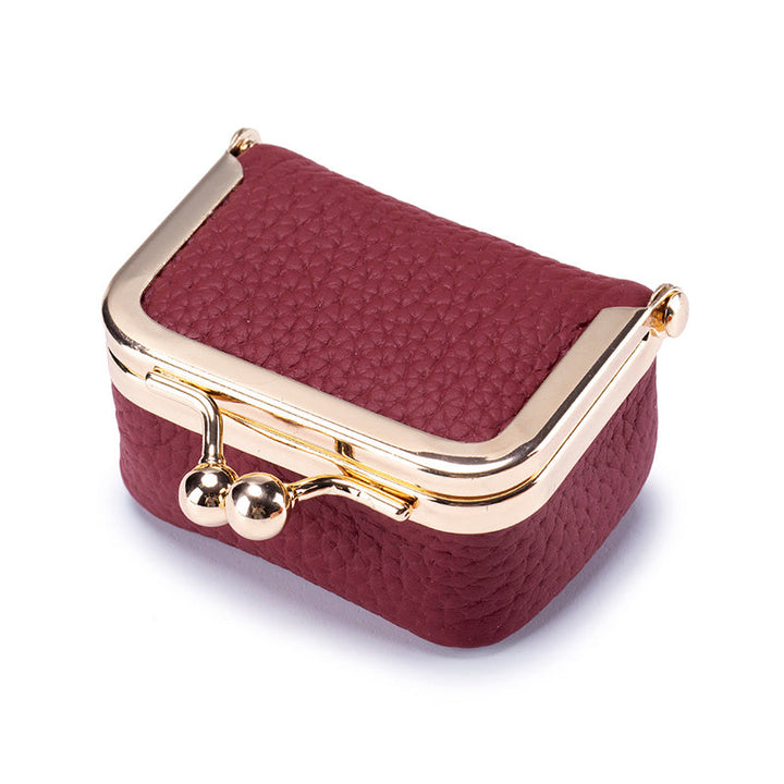 Women's mini travel jewelry box with multiple compartments, genuine leather for organized rings and earrings.
