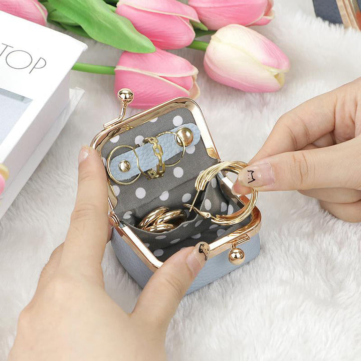 Fashionable mini travel jewelry box in genuine leather, perfect for women's on-the-go accessory storage.