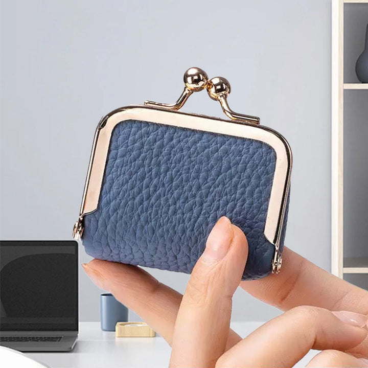 Women's compact leather jewelry box, mini travel organizer for rings, earrings, and delicate accessories.