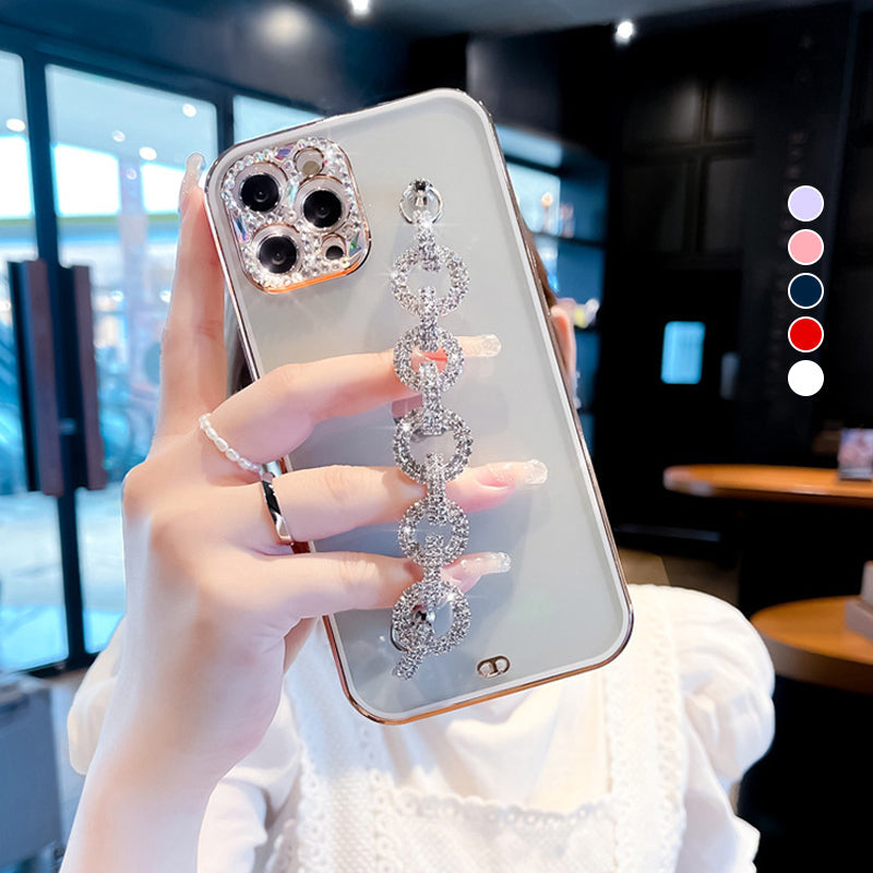 Close-up of a women's rhinestone phone case with a dazzling bracelet and glitter finish