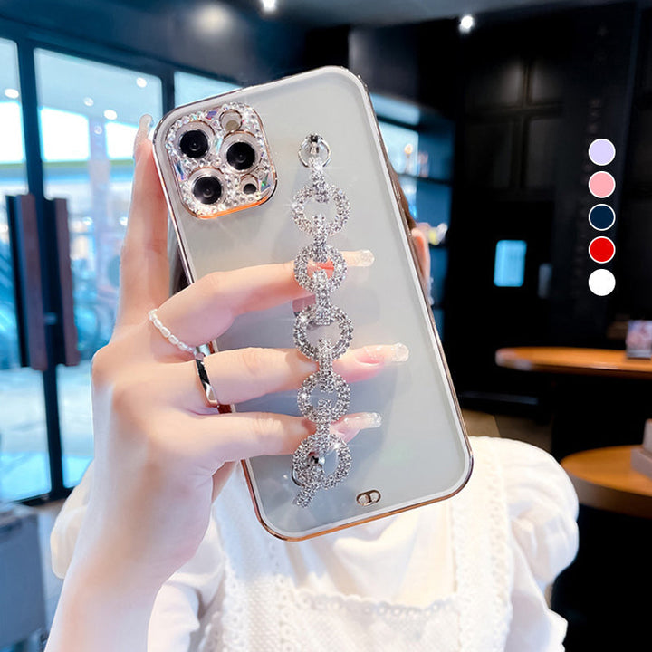 Close-up of a women's rhinestone phone case with a dazzling bracelet and glitter finish