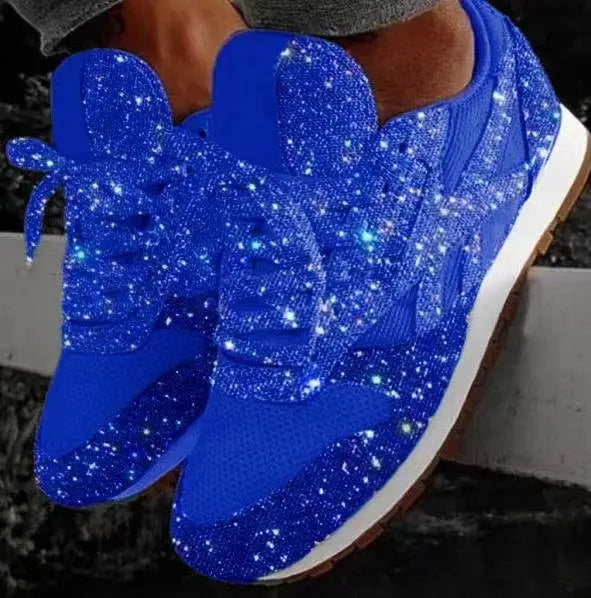 Close-up of women's shimmering glitter lace-up sneakers, perfect for everyday casual style.