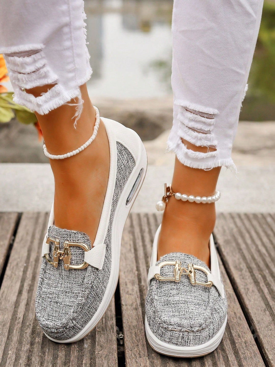 Women's gold buckle loafers, perfect everyday footwear offering comfort and effortless slip-on style.