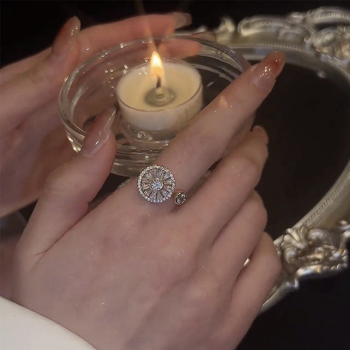 Elegant women's crystal spinner ring in gold, a unique jewelry piece for anxiety management.