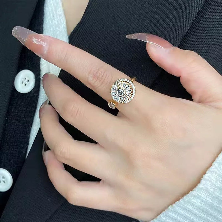 Women's gold spinner ring featuring clear crystals, a chic and calming accessory for daily wear.