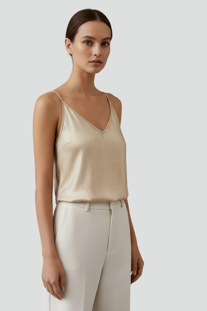 Modern gold women's V-neck top, sleeveless with thin straps, offering versatile style for any casual occasion.