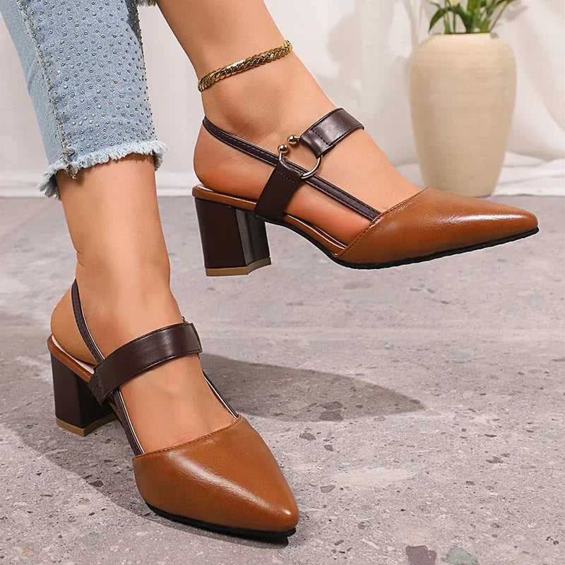 Golden ring accent block heels for women, black leather construction, ideal for dressy occasions.