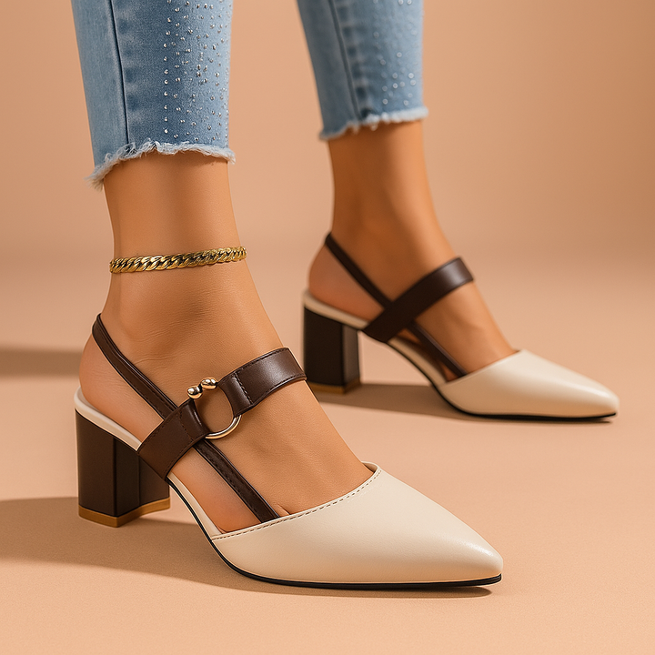 Black leather block heels, women's dress shoes with a striking golden ring accent, formal wear.