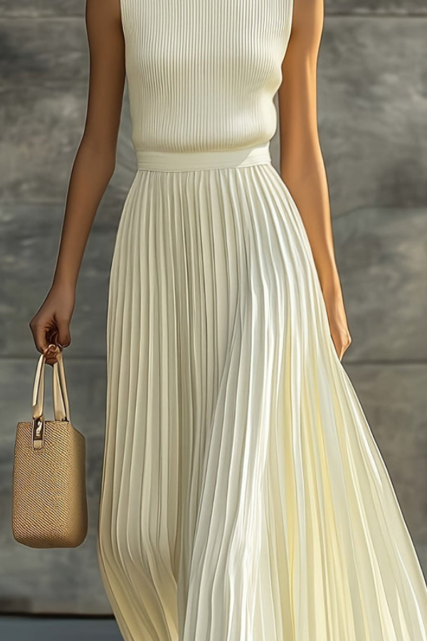 Flowy sleeveless pleated midi dress for women, ideal for a summer brunch, vacation, or elegant day wear.