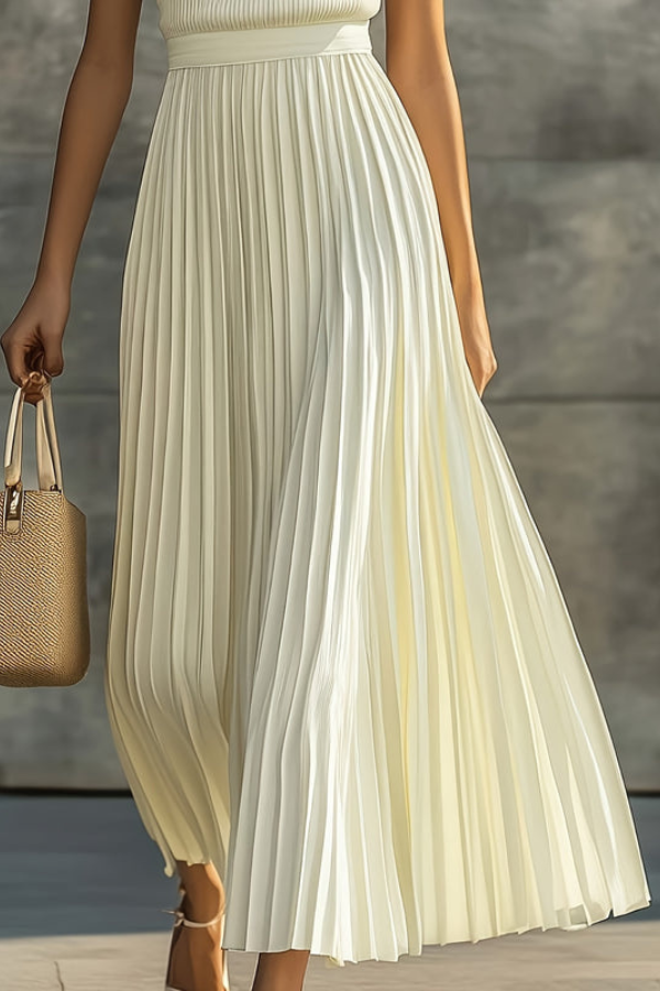 Stylish women's pleated sleeveless midi dress. A versatile summer dress, perfect for casual outings or elegant events.