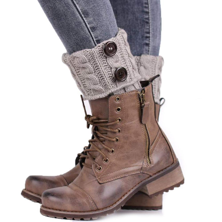 Pair of women's chunky knit boot toppers with prominent decorative buttons, cozy leg warmers