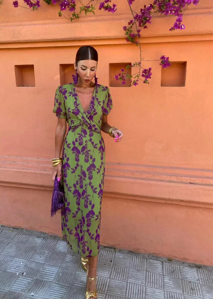 Women's green floral midi wrap dress with elegant V-neckline and stylish puff sleeves, perfect for summer parties.