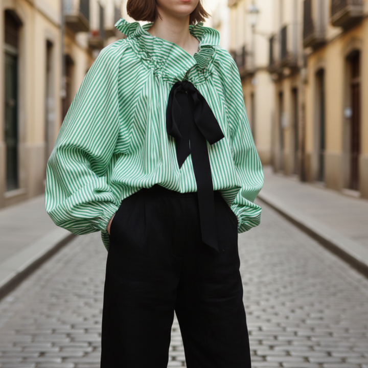 Women's green striped ruffle blouse with chic bow tie detail & elegant balloon sleeves, perfect for office or formal wear.