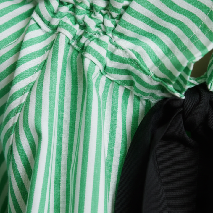 Sophisticated taupe striped ruffle blouse with a fashionable bow tie & long sleeves, versatile for elegant occasions.