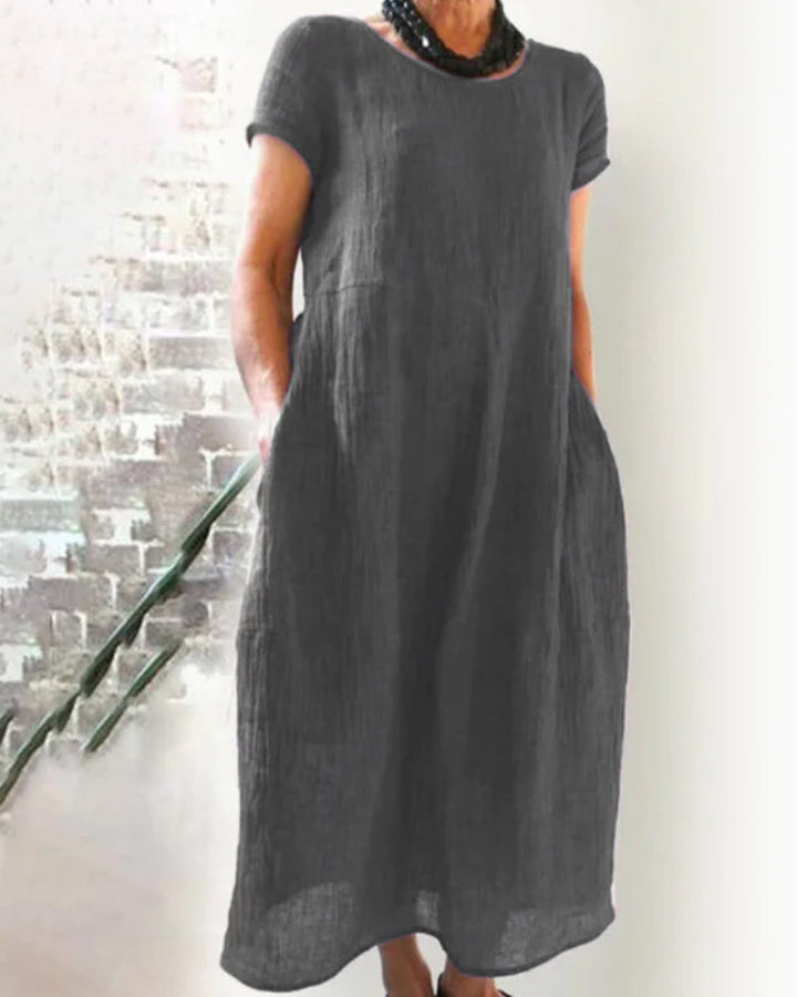 Versatile women's o-neck midi dress with a loose fit, perfect for casual spring, summer, or fall fashion.