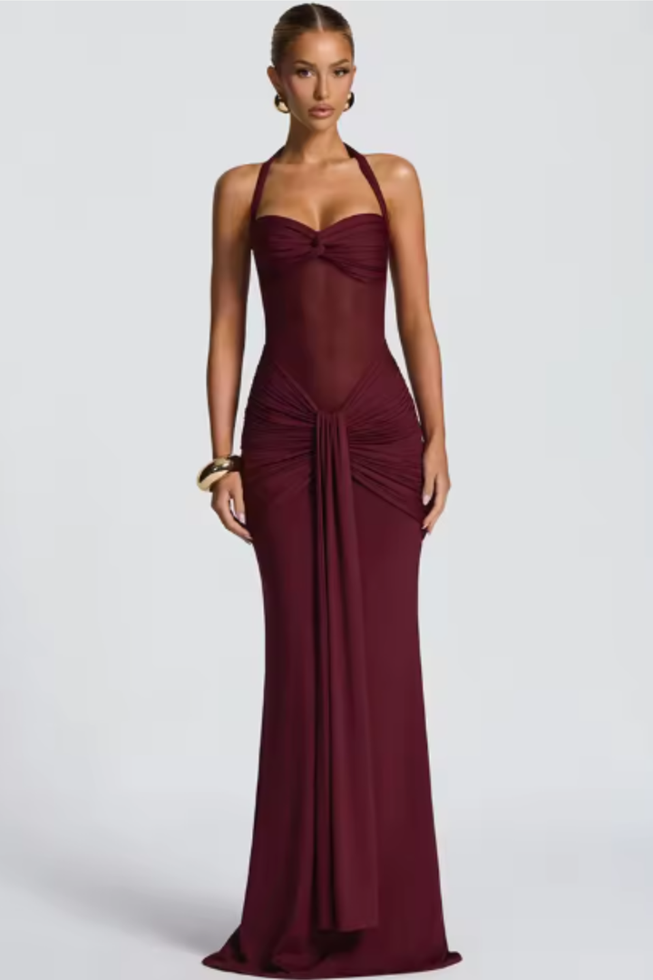 Elegant women's halter neck bodycon maxi dress with ruched details, perfect for formal evening wear.