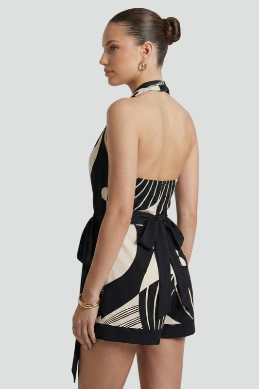 Versatile women's halter wrap mini dress with a tie waist. Perfect sleeveless summer dress for casual or party wear.
