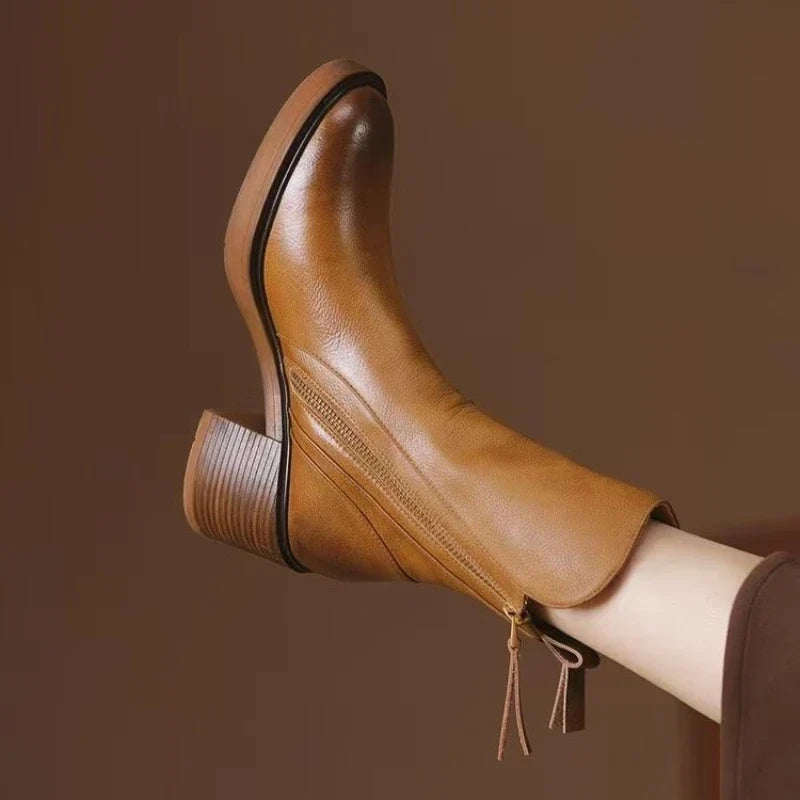 Women's high heel ankle boots with zipper and shock-absorbing sole for stylish comfort.