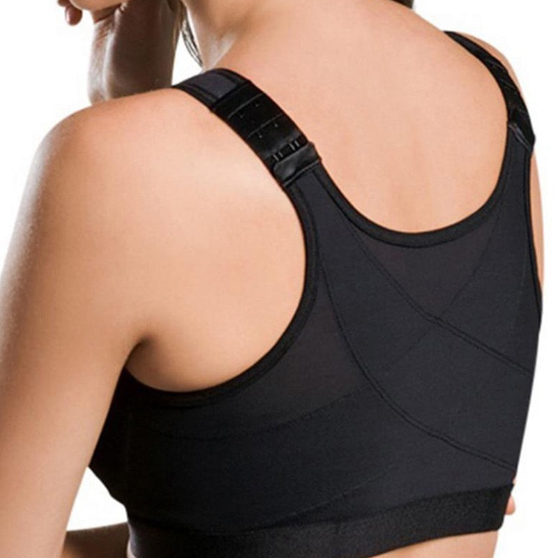 Model wearing a women's high impact sports bra vest during a high-intensity workout session.