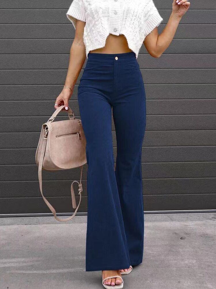 Women's high-waisted wide-leg black pants with pockets, perfect for versatile everyday wear.