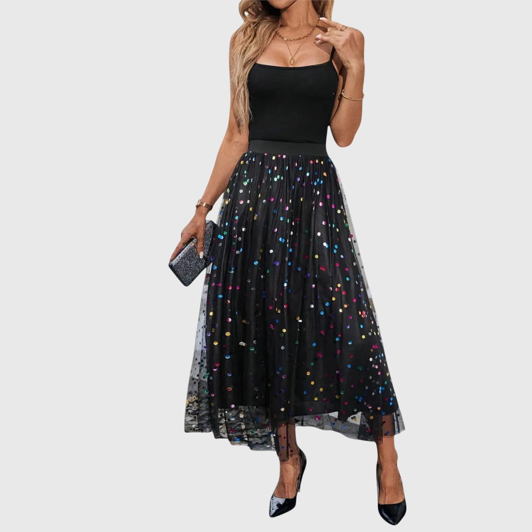 Women's high-waist black midi skirt with shimmering sequin overlay and asymmetric hem, perfect for evening wear.
