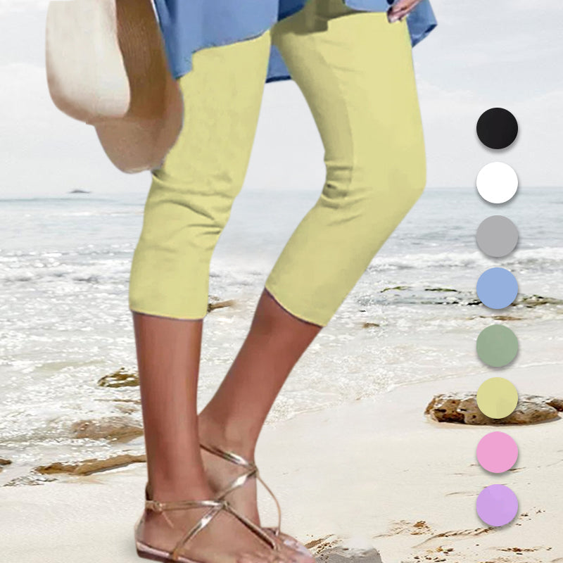 Model demonstrating the flexibility of high waist knee-length leggings for active women
