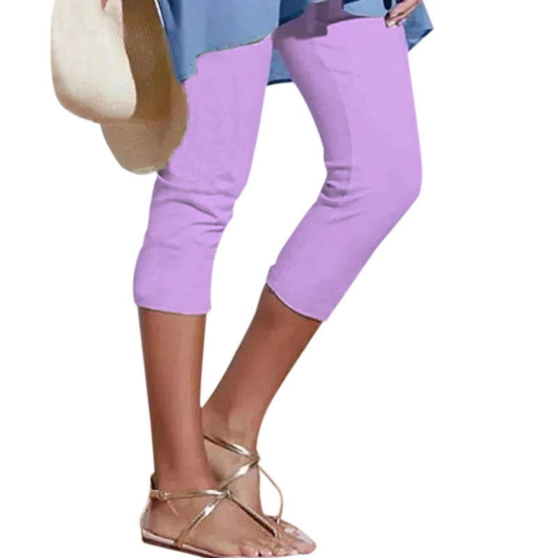 Stack of folded women's high waist knee-length leggings in various colors