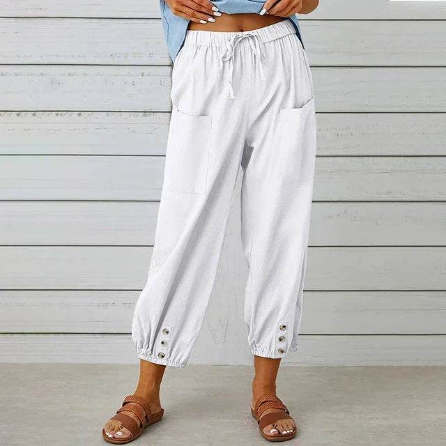 Relaxed fit women's high-waisted ankle pants with a functional drawstring for comfort.