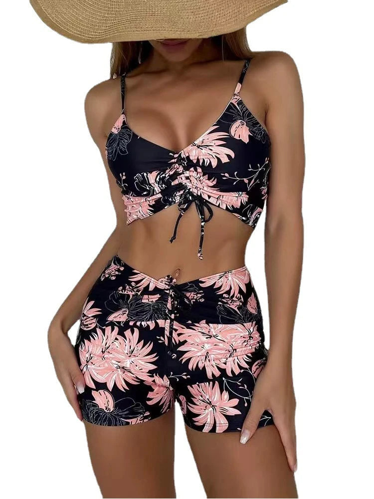 Trendy women's high-waist floral bikini, a flattering two-piece swimsuit for vacation.