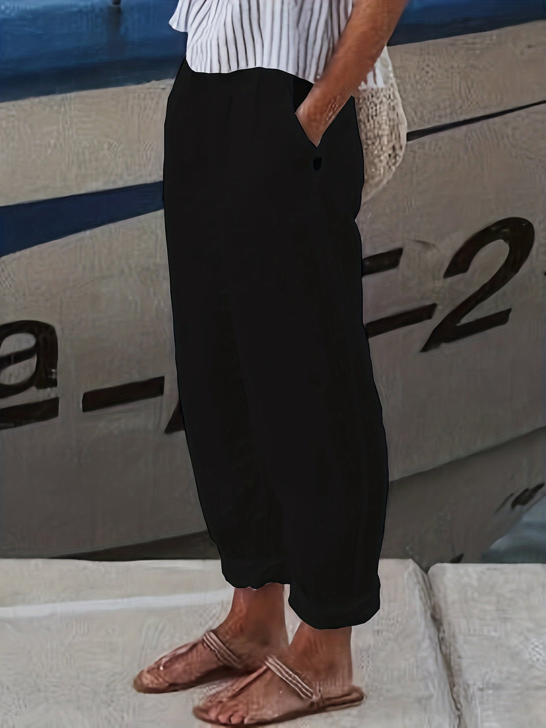 Lightweight women's high waist summer pants with roll hem, ideal for warm weather.