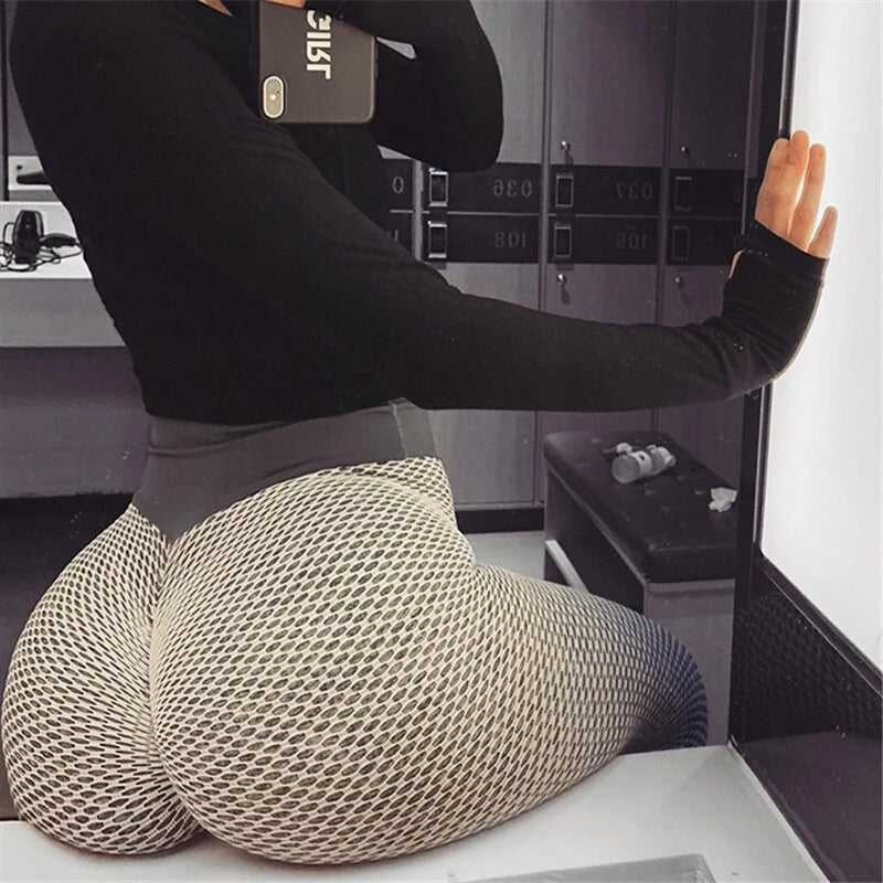 Close-up of the scrunch butt lifting detail on black high-waist women's athletic leggings