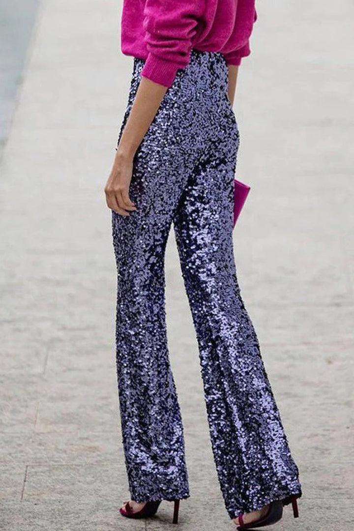 Sparkling women's sequin flared trousers, ideal for a festive and glamorous evening look