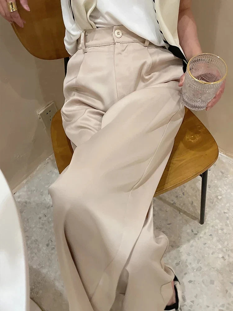 Effortless women's high waist wide leg pants, chic loose fit, versatile for summer looks.