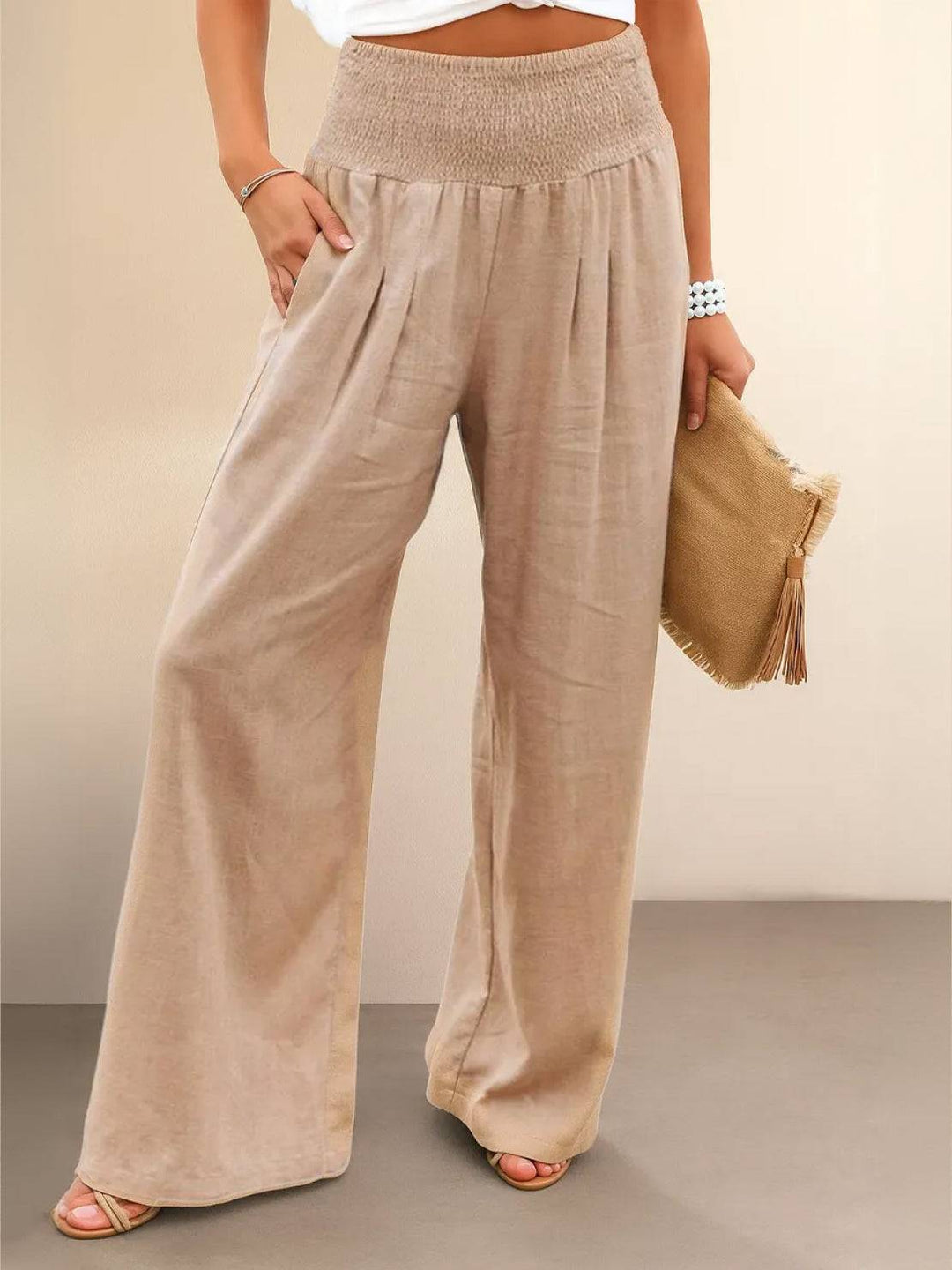 Women's high waist wide leg trousers with comfortable smocked elastic waist, relaxed fit.