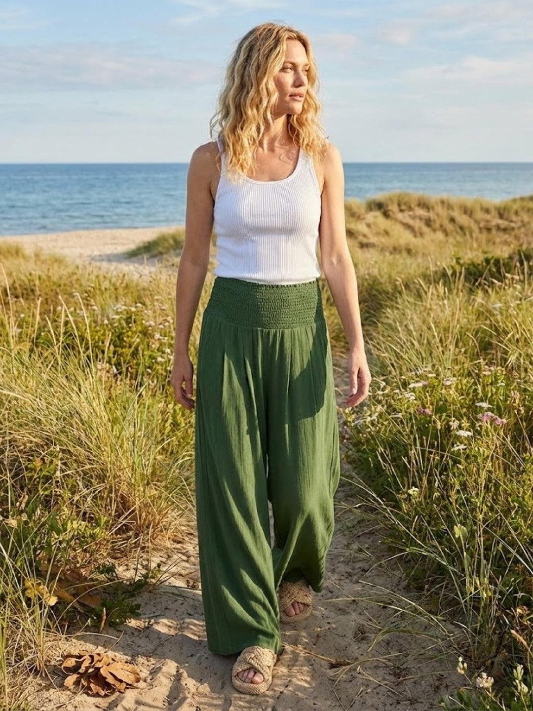 Stylish women's smocked waist high rise wide leg pants, perfect for a chic casual look.