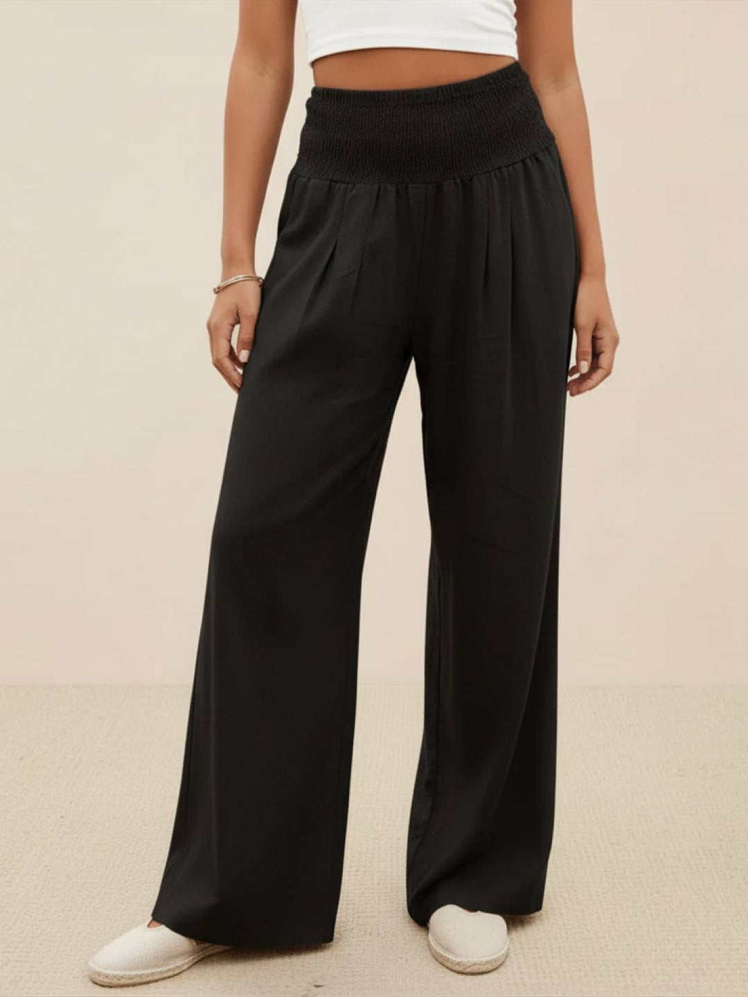 Women's casual wide leg pants with high smocked waist, ideal for relaxed spring outfits.
