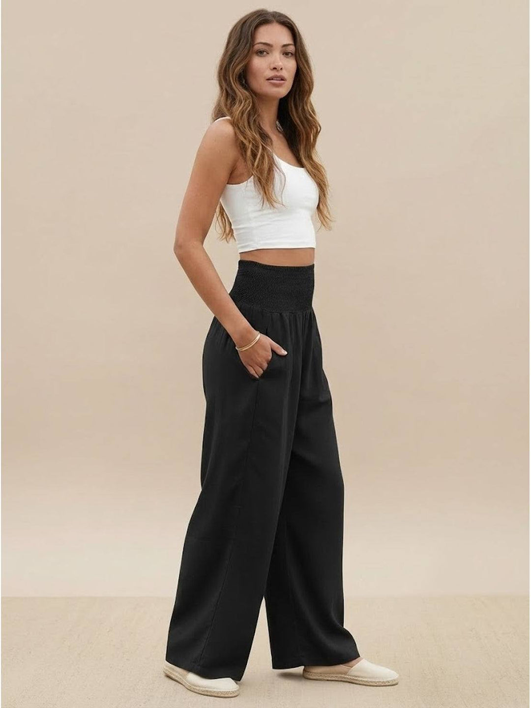 Chic women's wide leg pants, high smocked waist, perfect for versatile summer styling.