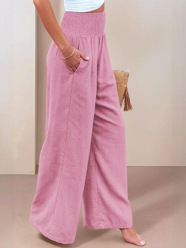 Relaxed fit women's high waist wide leg trousers, smocked waist for ultimate comfort.