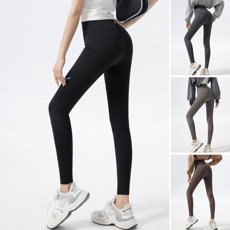 Comfortable women's fitness leggings with a unique alphabet shark print, high-waisted for yoga.