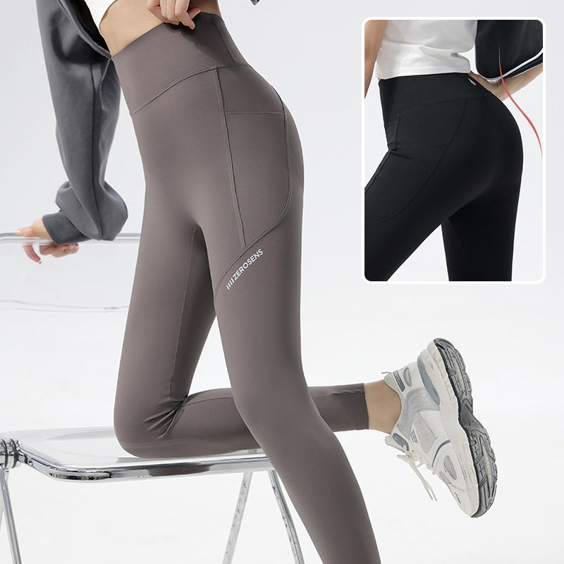 Women's alphabet shark pattern leggings, perfect high-waist activewear for yoga and fitness.