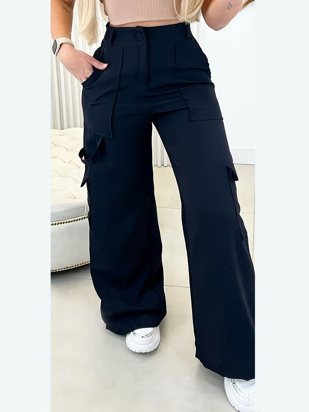 Women's high-waisted black cargo wide-leg pants. Stylish & comfortable for modern casual wear, featuring practical pockets.