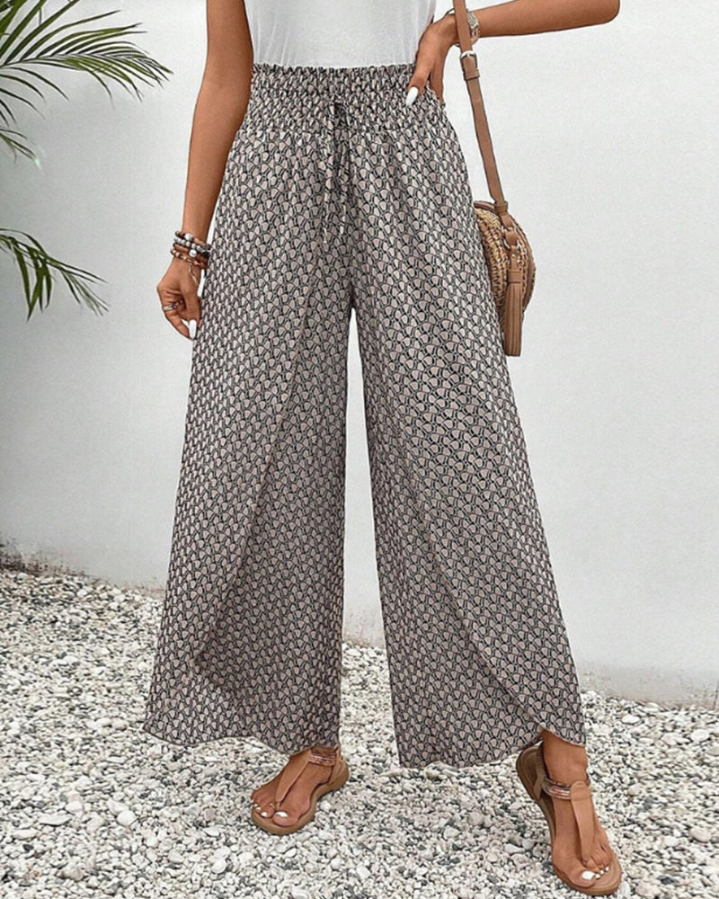 Women's high-waisted geometric pattern trousers, modern & stylish wide-leg design for versatile fashion.