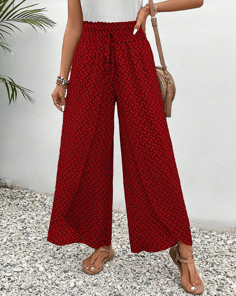 Versatile women's high-waisted geometric pattern wide-leg trousers. Stylish, modern, and comfortable for any occasion.