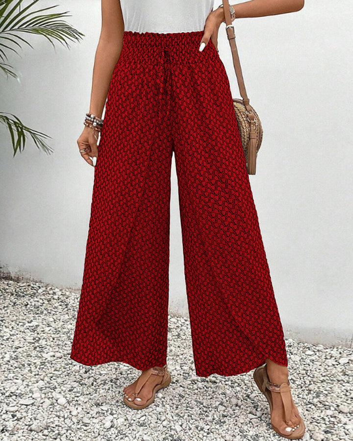 Versatile women's high-waisted geometric pattern wide-leg trousers. Stylish, modern, and comfortable for any occasion.