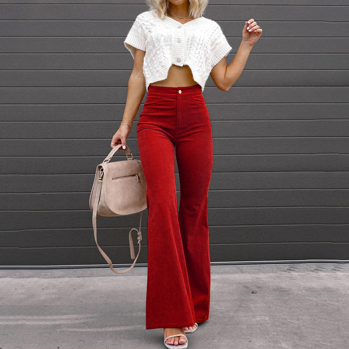 Versatile women's high-waisted flared pants with ribbed fabric, perfect for creating retro-inspired looks.