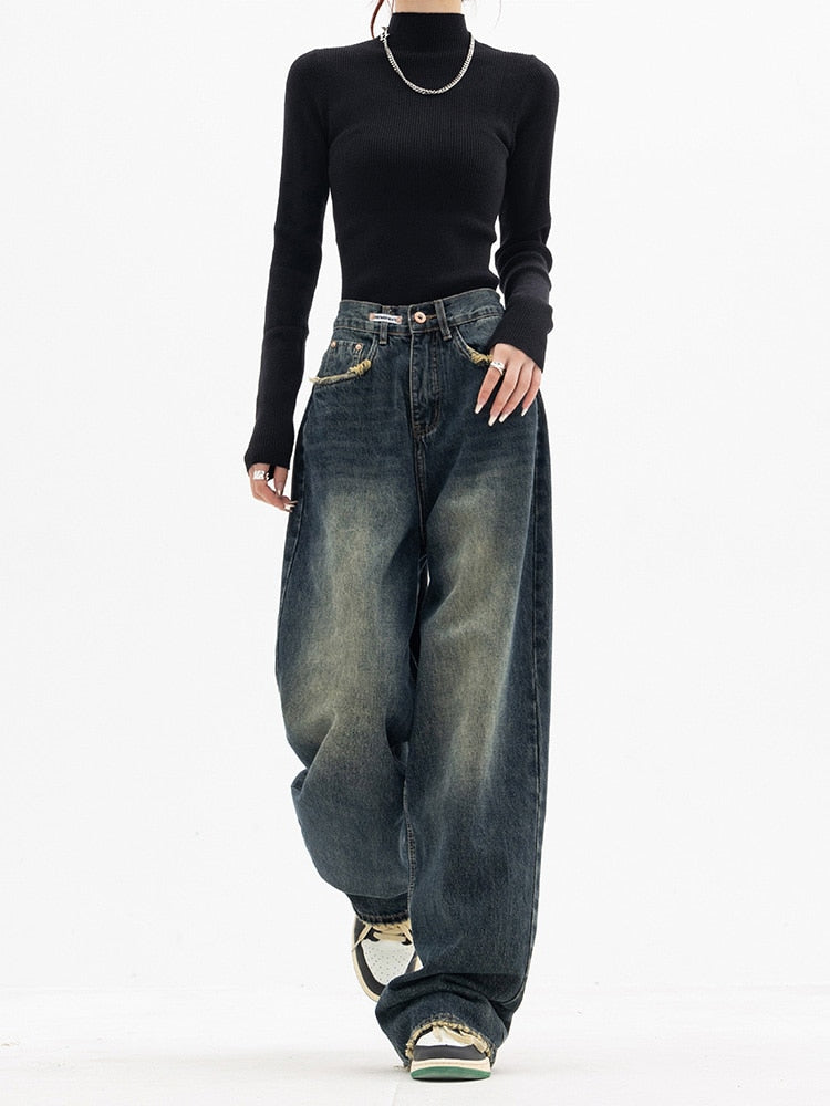 Women's high-waisted wide-leg denim jeans in a classic blue wash, perfect for casual streetwear.