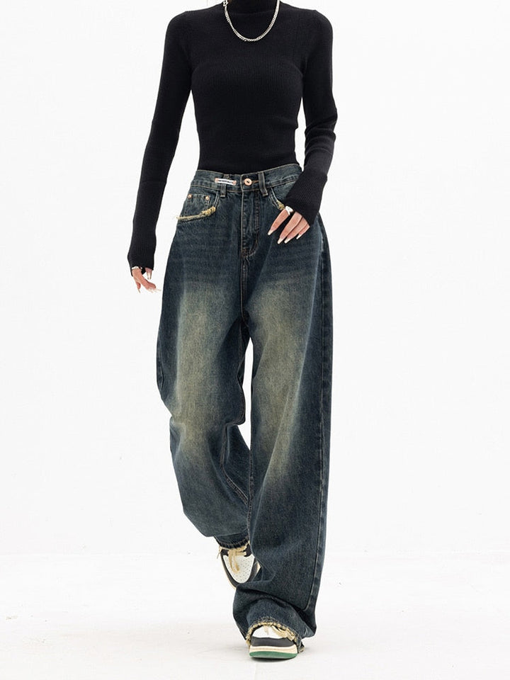 Fashionable women's blue denim wide-leg jeans with a high waist, offering a comfortable casual fit.