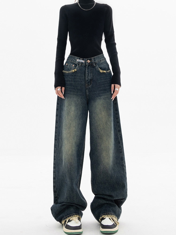 Stylish women's high-waisted blue denim jeans, featuring a trendy wide-leg design for modern fashion.