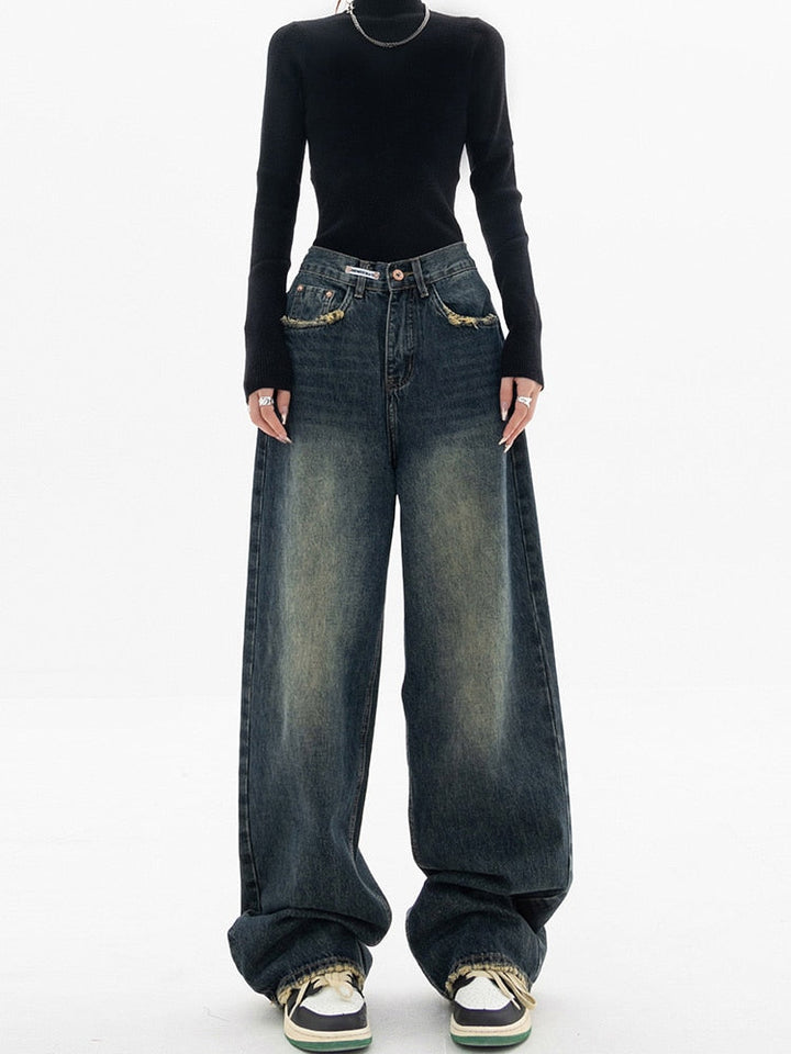 Stylish women's high-waisted blue denim jeans, featuring a trendy wide-leg design for modern fashion.